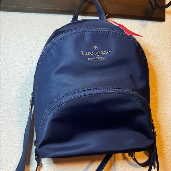 kate spade Handbags - Kate Spade navy backpack silver brand logo double adjustable straps NWT ♠️